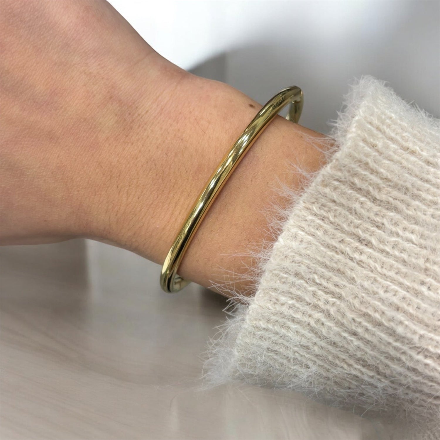 Bracciale rigido liscio in acciaio inossidabile dorato - SIddharta