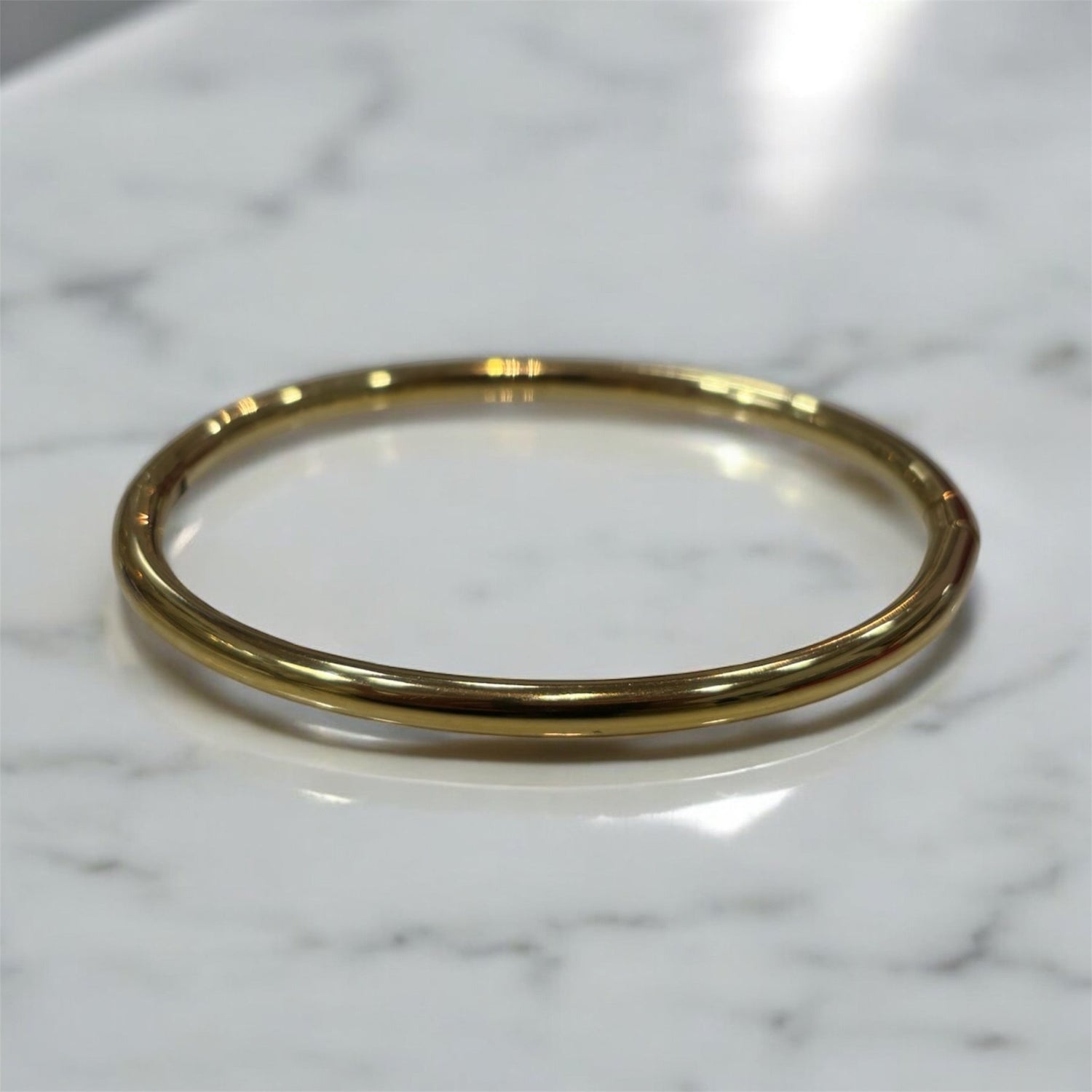 Bracciale rigido liscio in acciaio inossidabile dorato - SIddharta