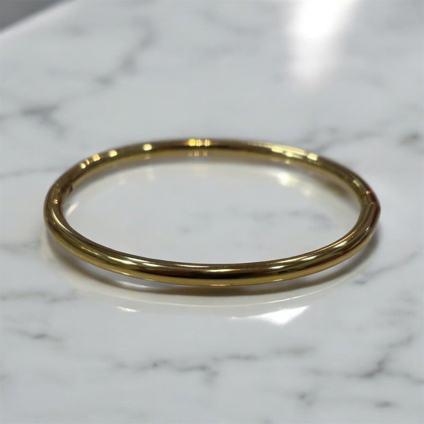 Bracciale rigido liscio in acciaio inossidabile dorato - SIddharta